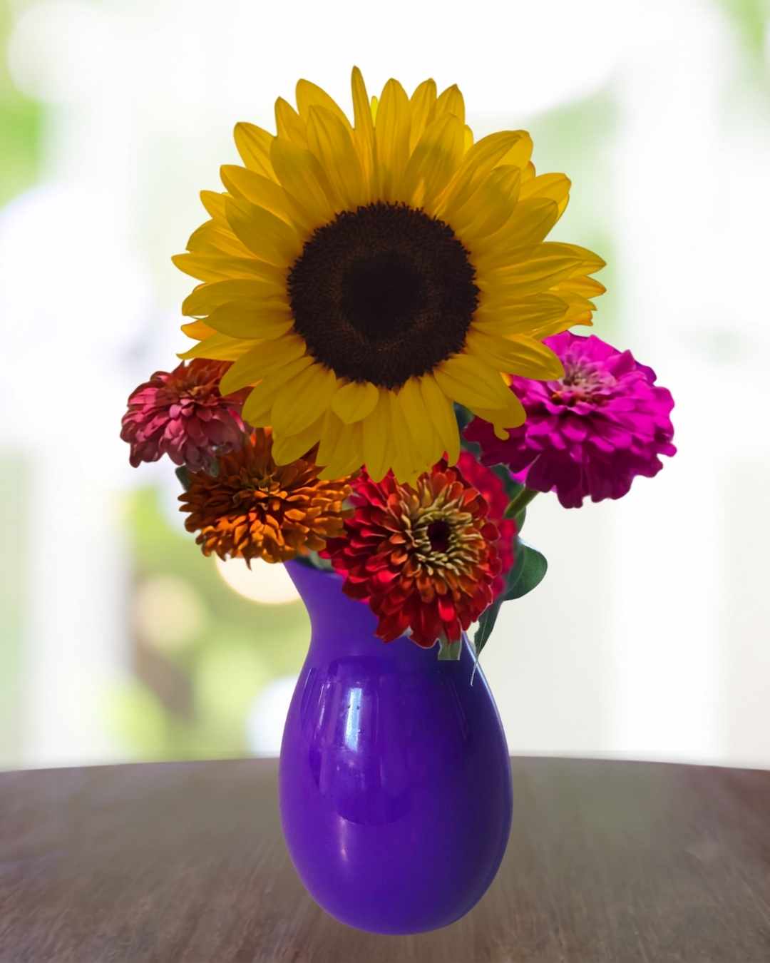Bright flowers in a purple vase